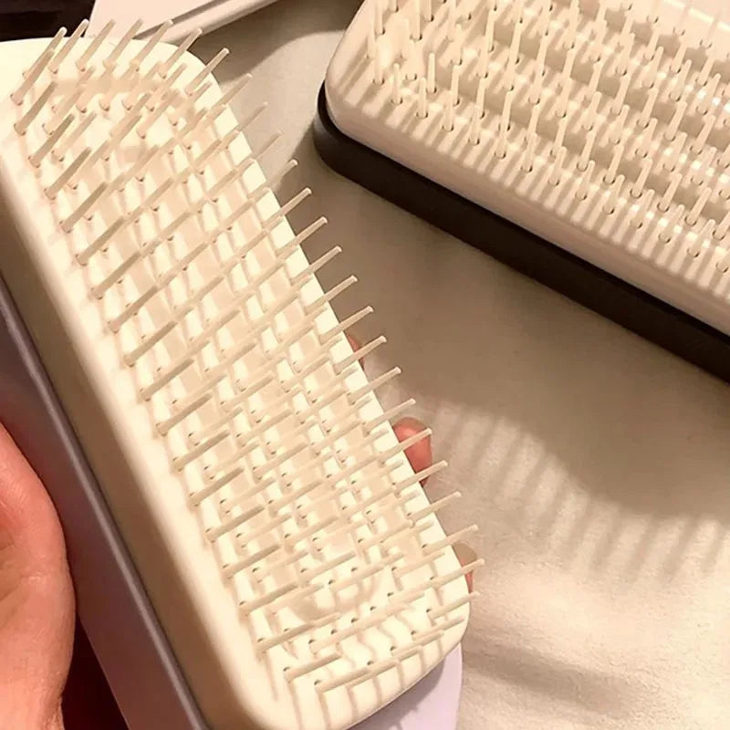 Twistclean - Self-Cleaning Anti-Static Massage Comb Scalable Rotate Lifting Self Cleaning Hairbrush